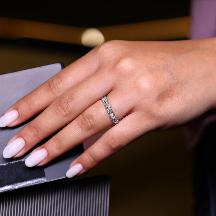 Shared prong setting holds pear cut diamonds securely.
