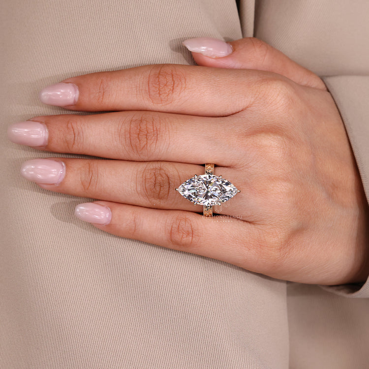 Lab grown marquise ring with milgrain and accent setting