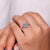Marquise shape outline with round diamond halo style.
