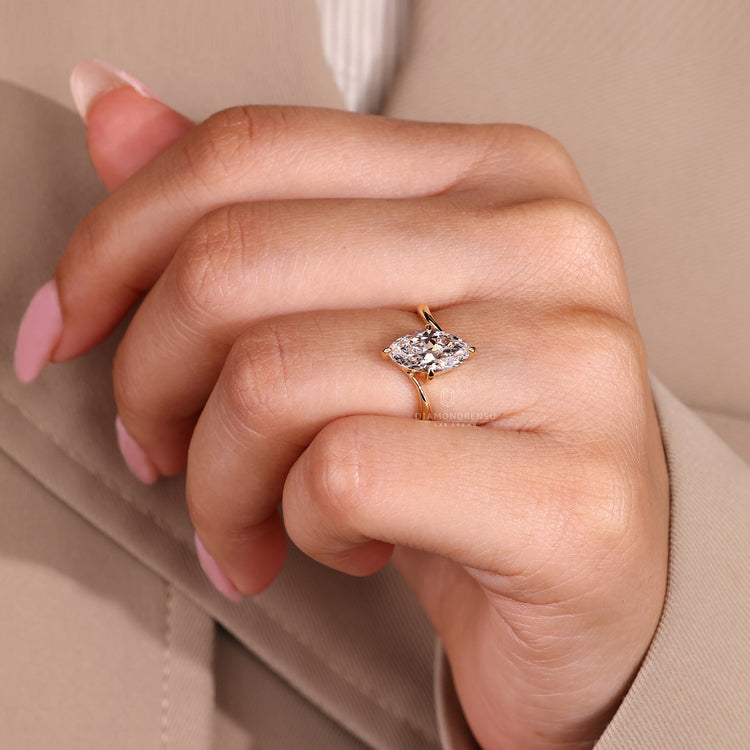 Handmade solitaire engagement ring with marquise old european cut diamond.