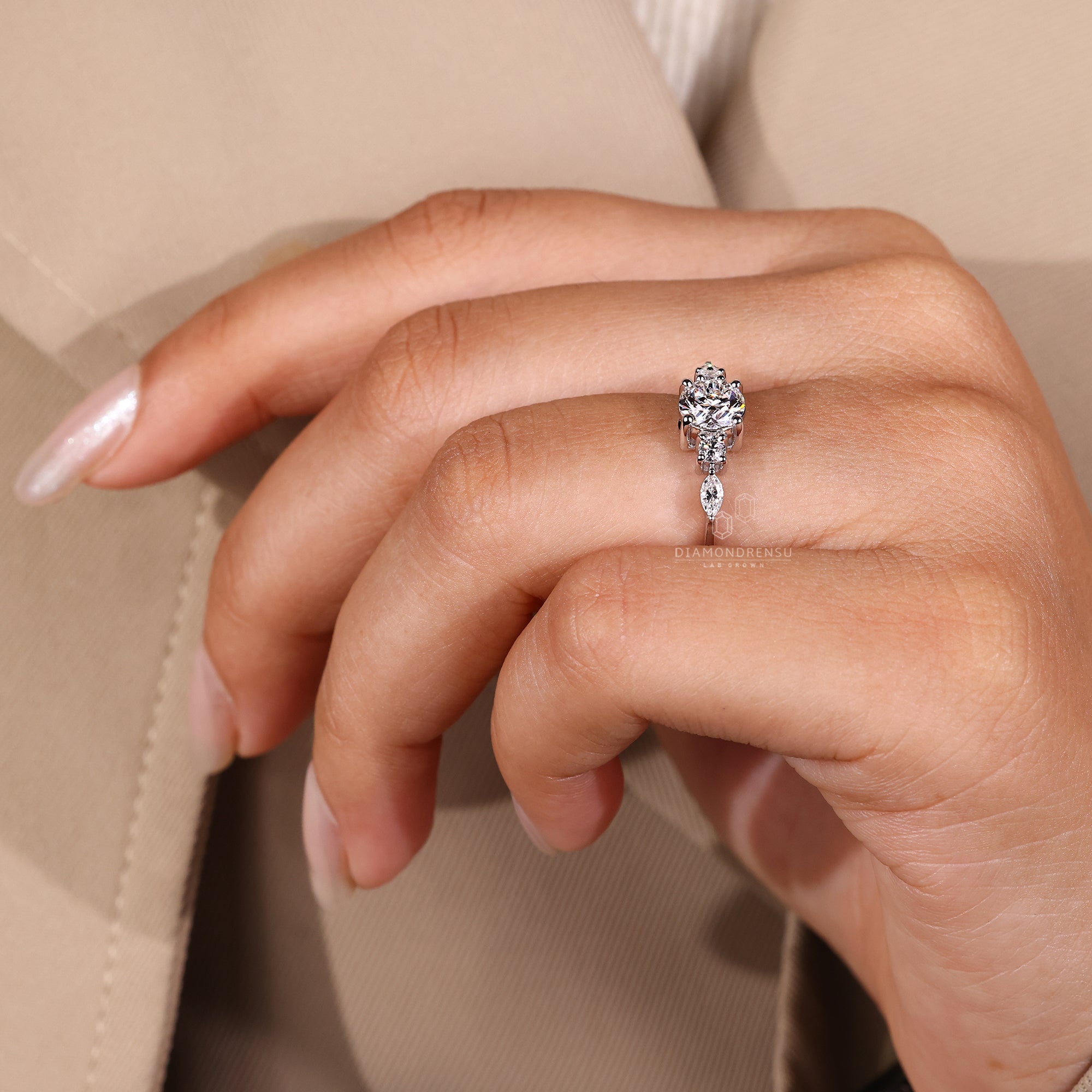 Marquise cut side stone ring with round center.
