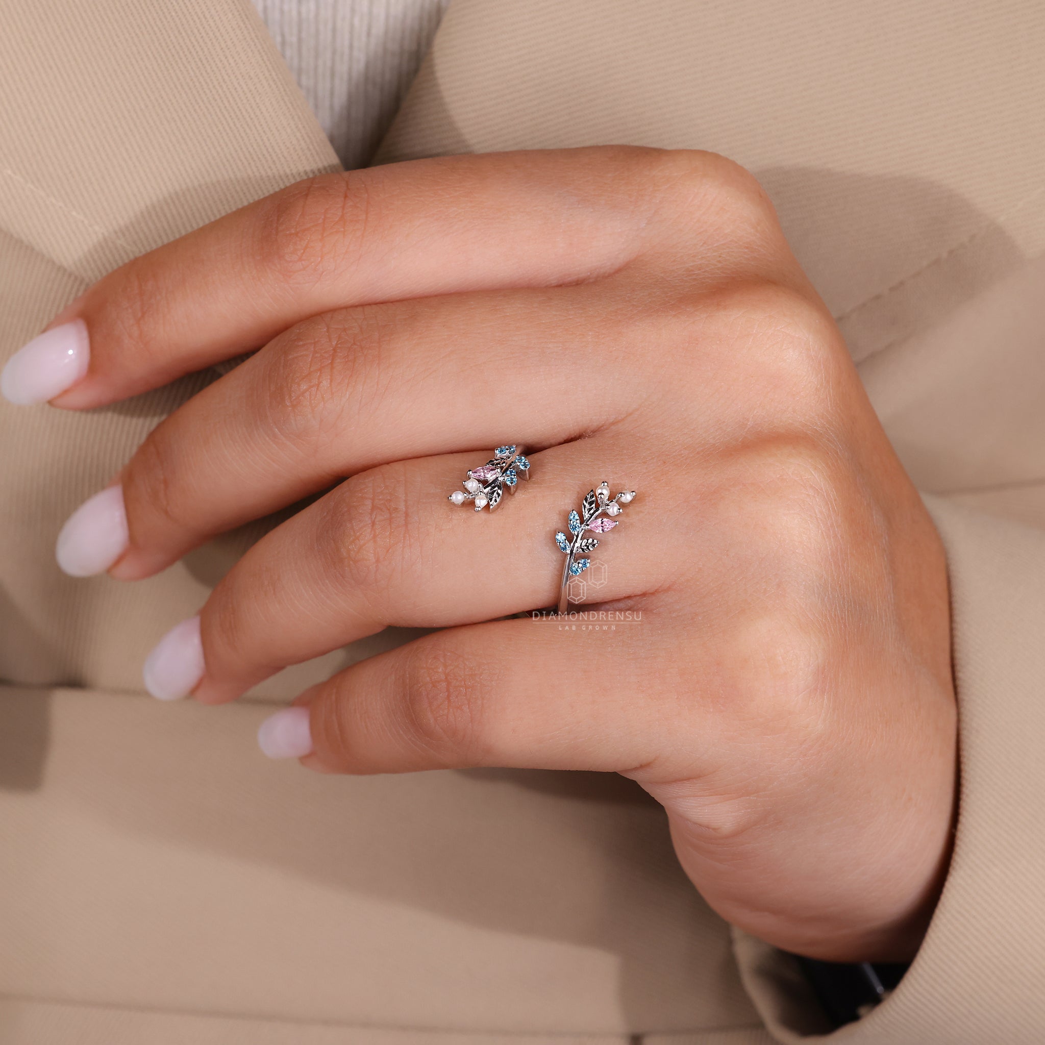 Elegant white gold band with round pearl and handcrafted design.
