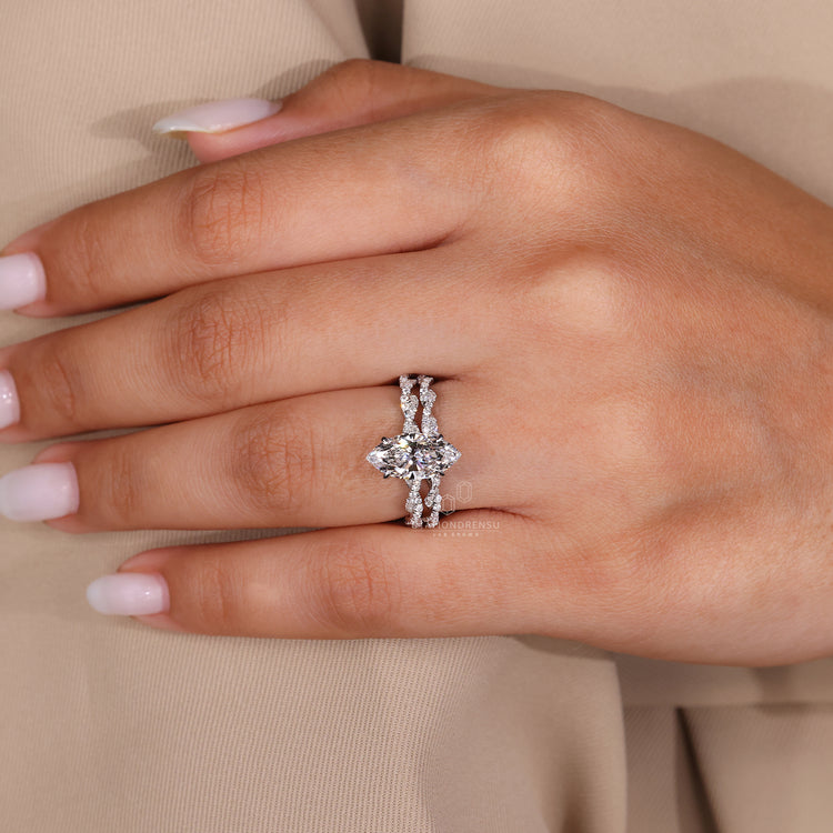 White gold bridal set designed with hidden halo and claw setting.

