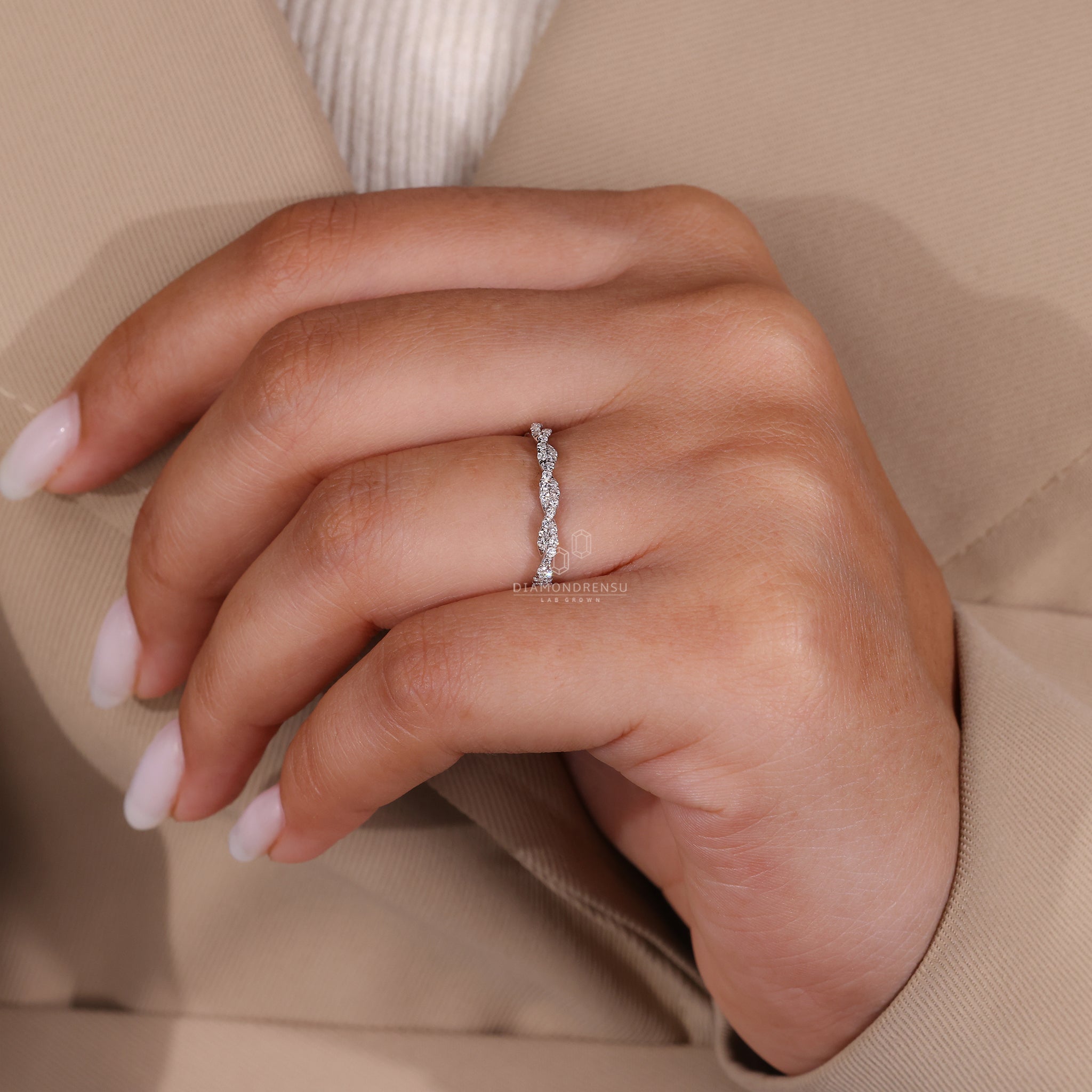 Prong set wedding band with sparkling round cut diamonds.