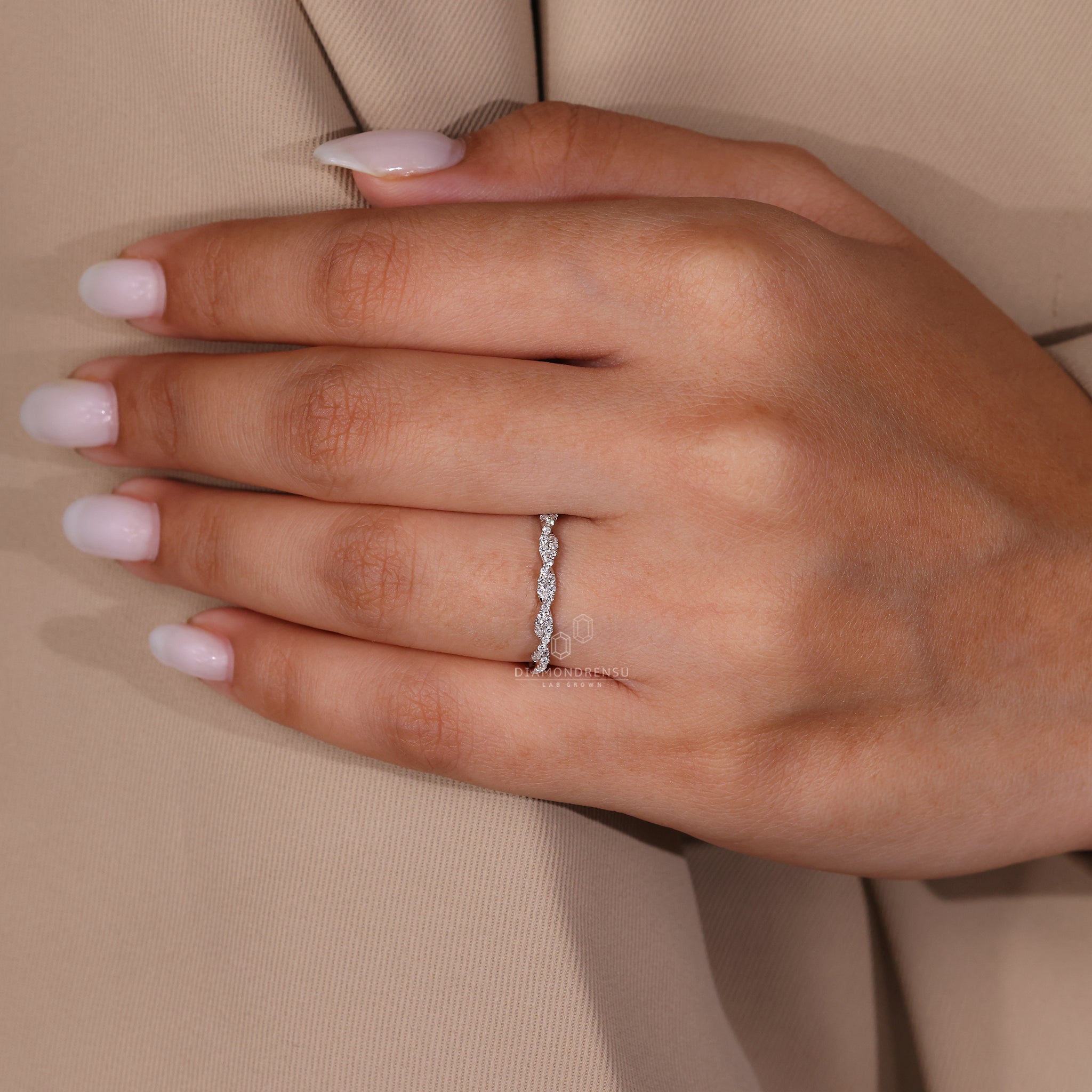 Handmade jewellery showcasing a prong set diamond wedding band.