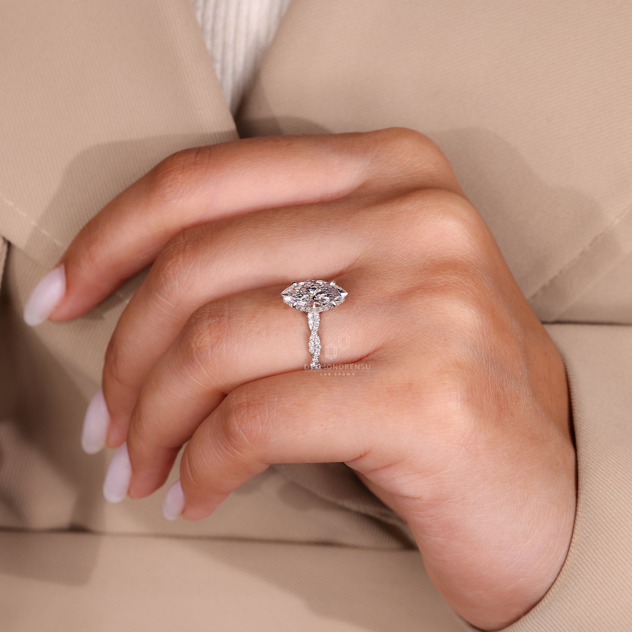 Diamond twist engagement ring in custom engagement ring design.
