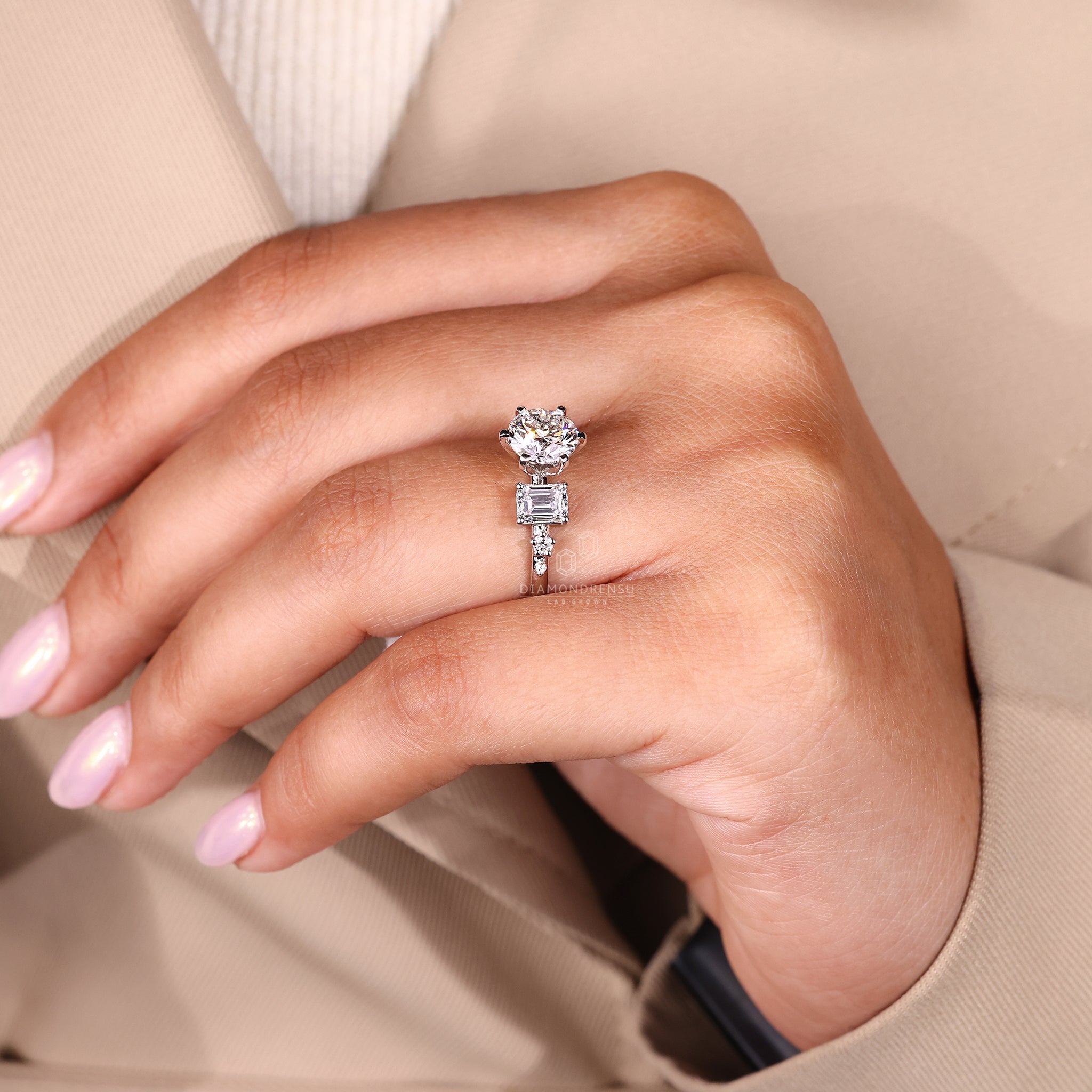 Round cut diamond ring in a six tab prong setting.
