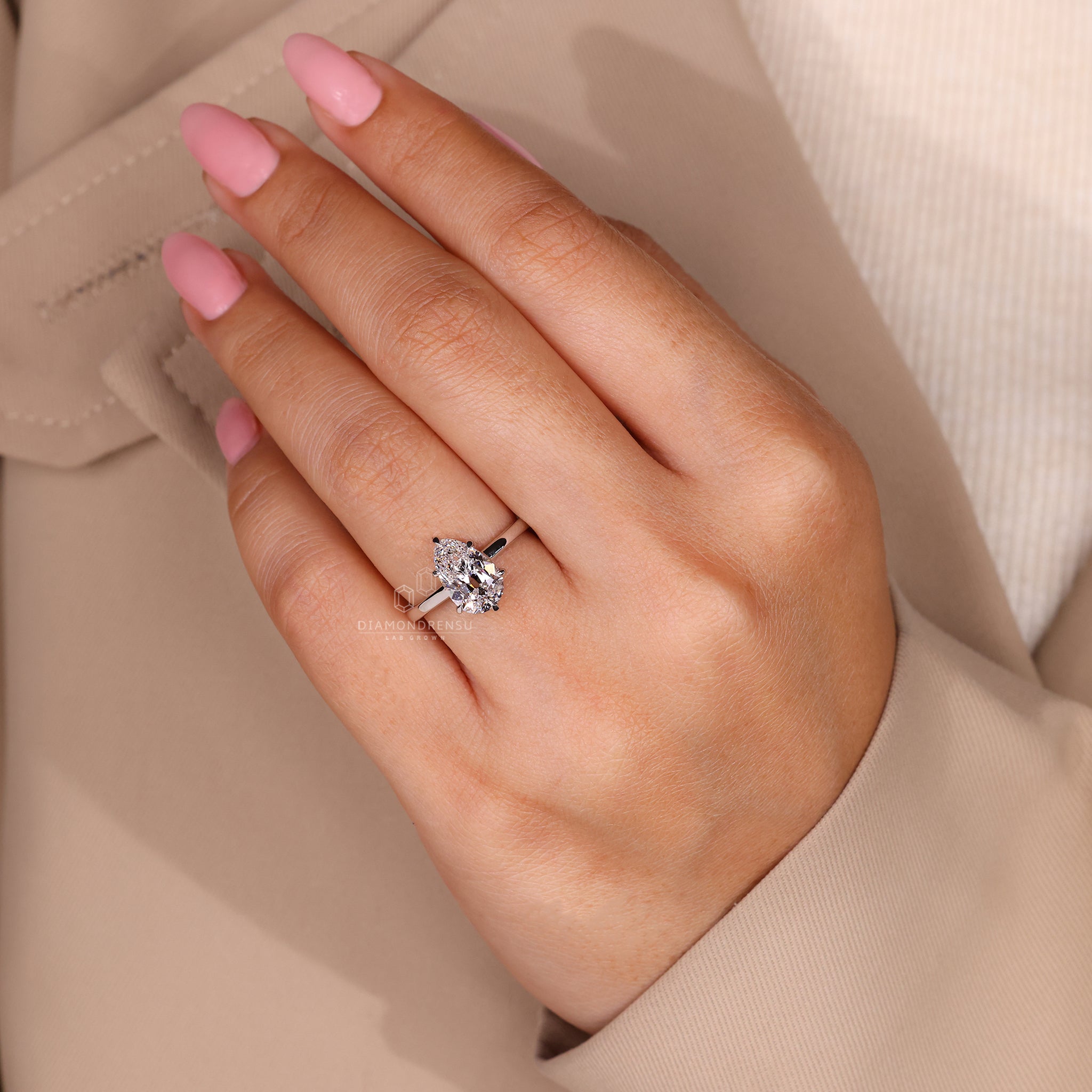 Custom diamond ring with old European cut centre stone and solitaire setting.