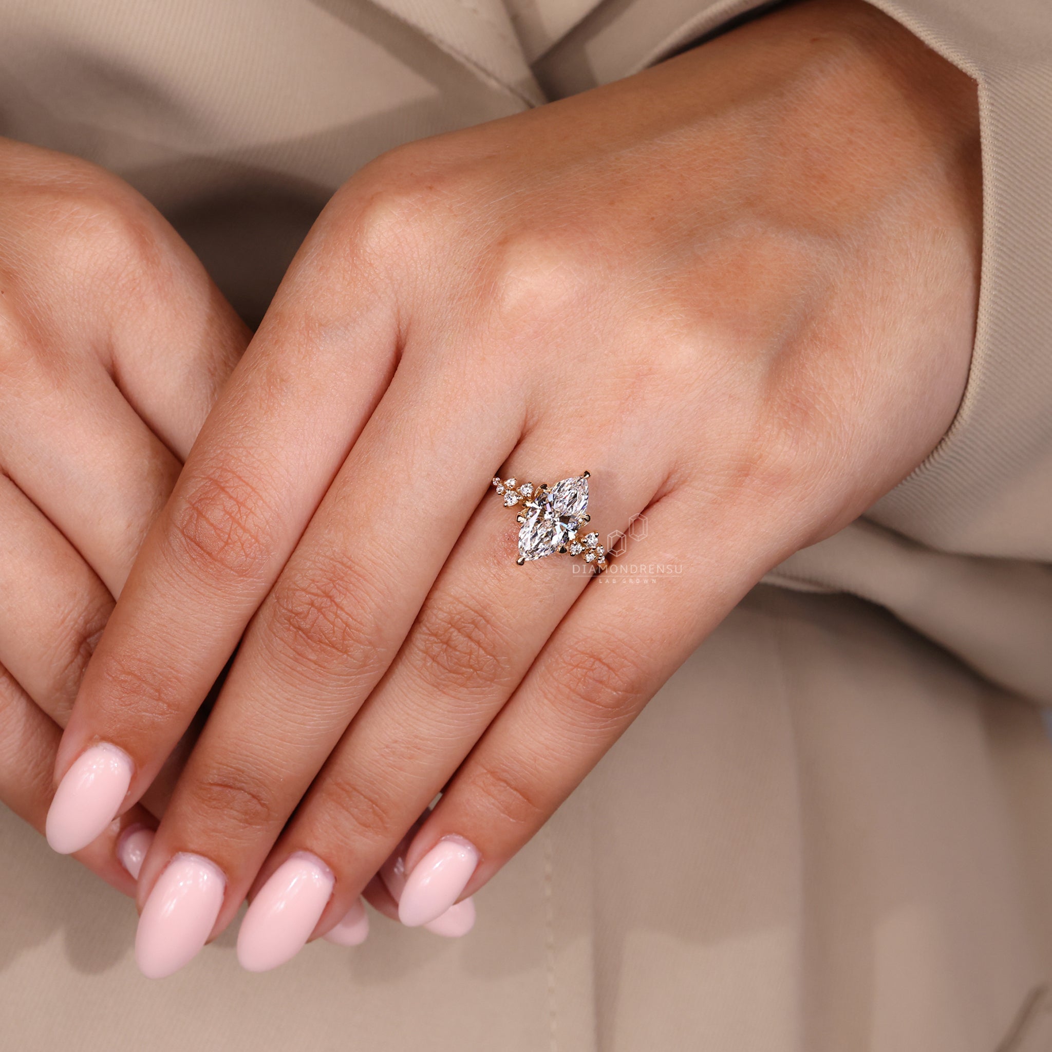 Marquise diamond side stone in igi certified ring setting.
