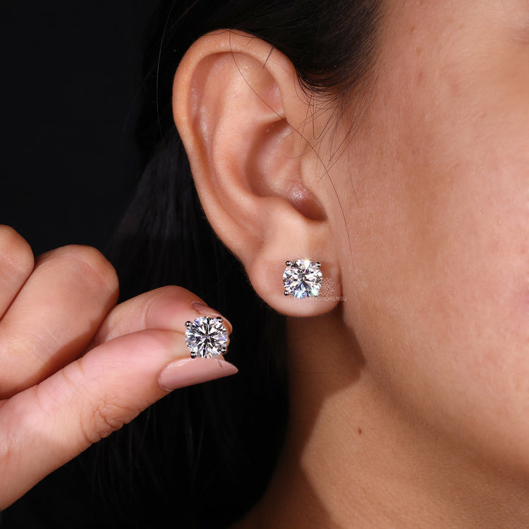 Push back round diamond stud earrings.