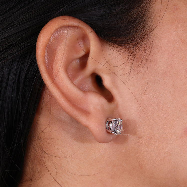 Classic 4 prong diamond stud earrings.