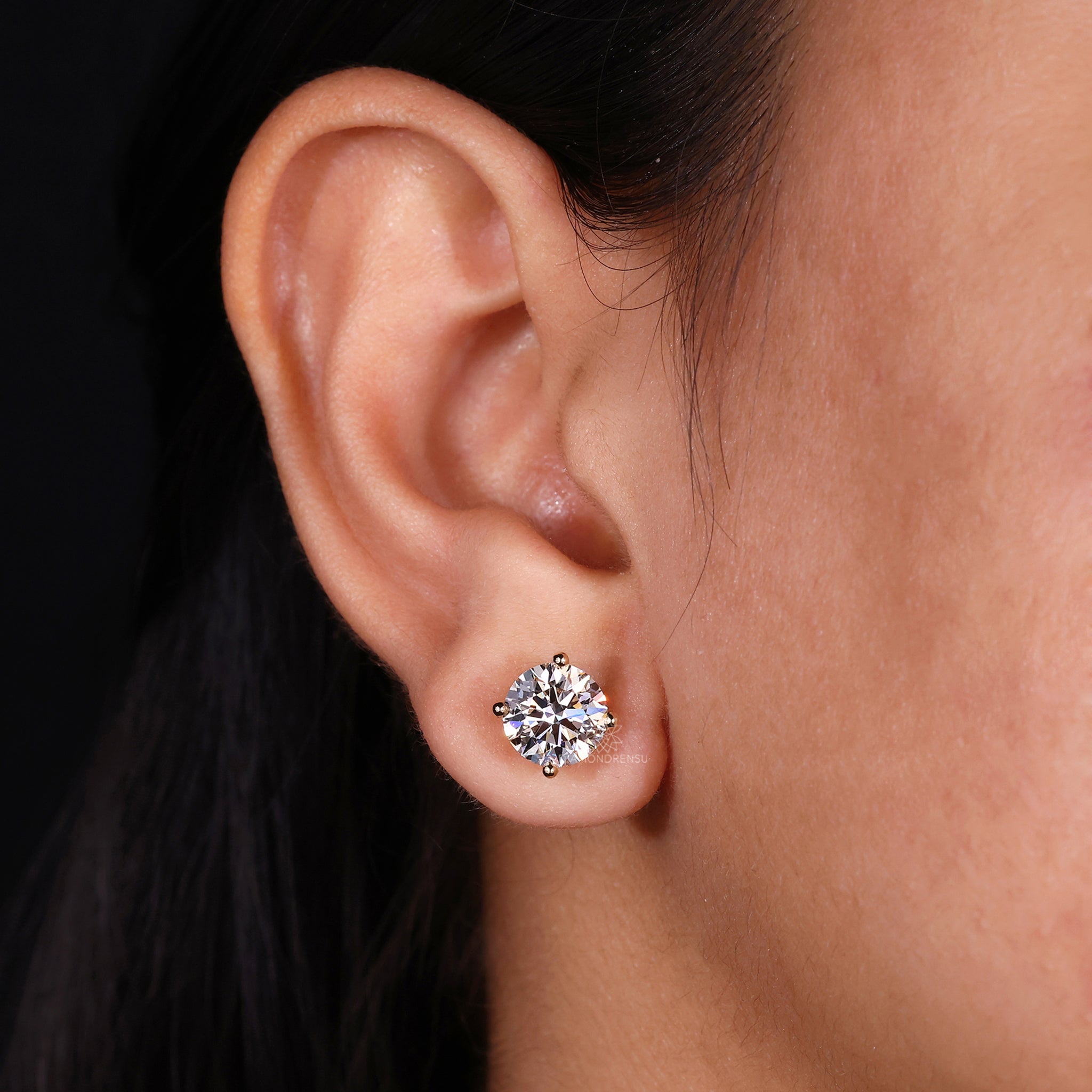 Screw back diamond earrings in gold.