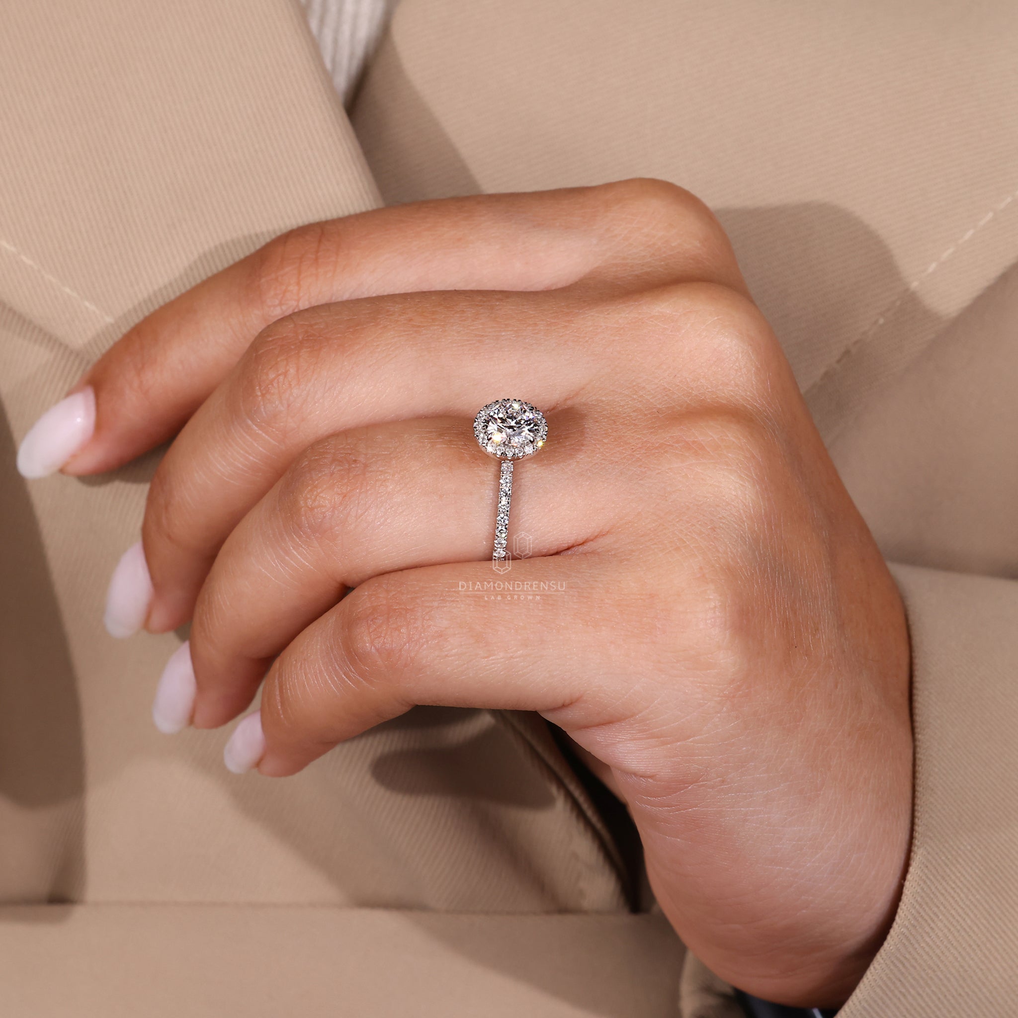 Custom engagement ring with round halo and hidden accents.
