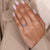 Round cut halo ring with lab grown center diamond.

