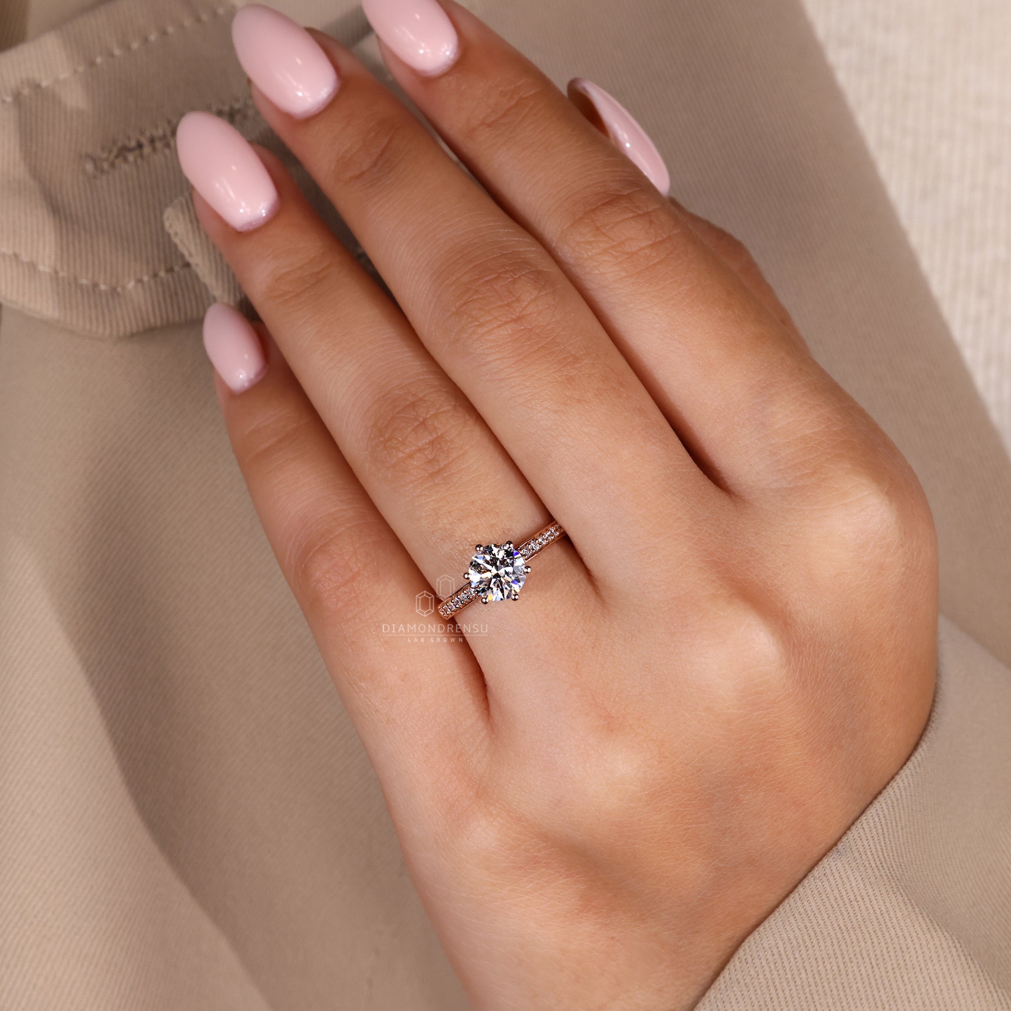 Hidden halo engagement ring with handmade jewelry detailing.
