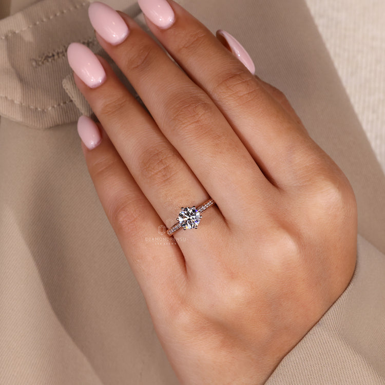 Hidden halo engagement ring with handmade jewelry detailing.

