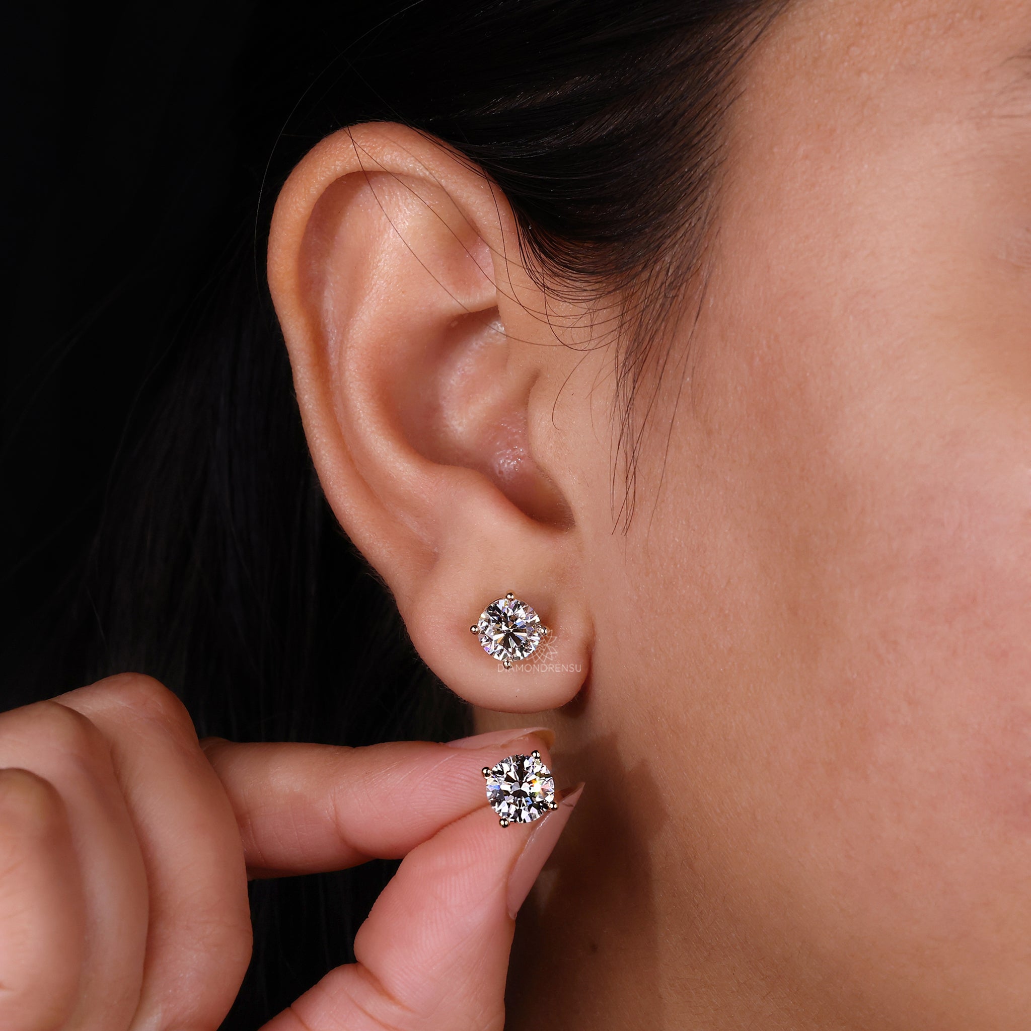 Four prong setting diamond earrings.