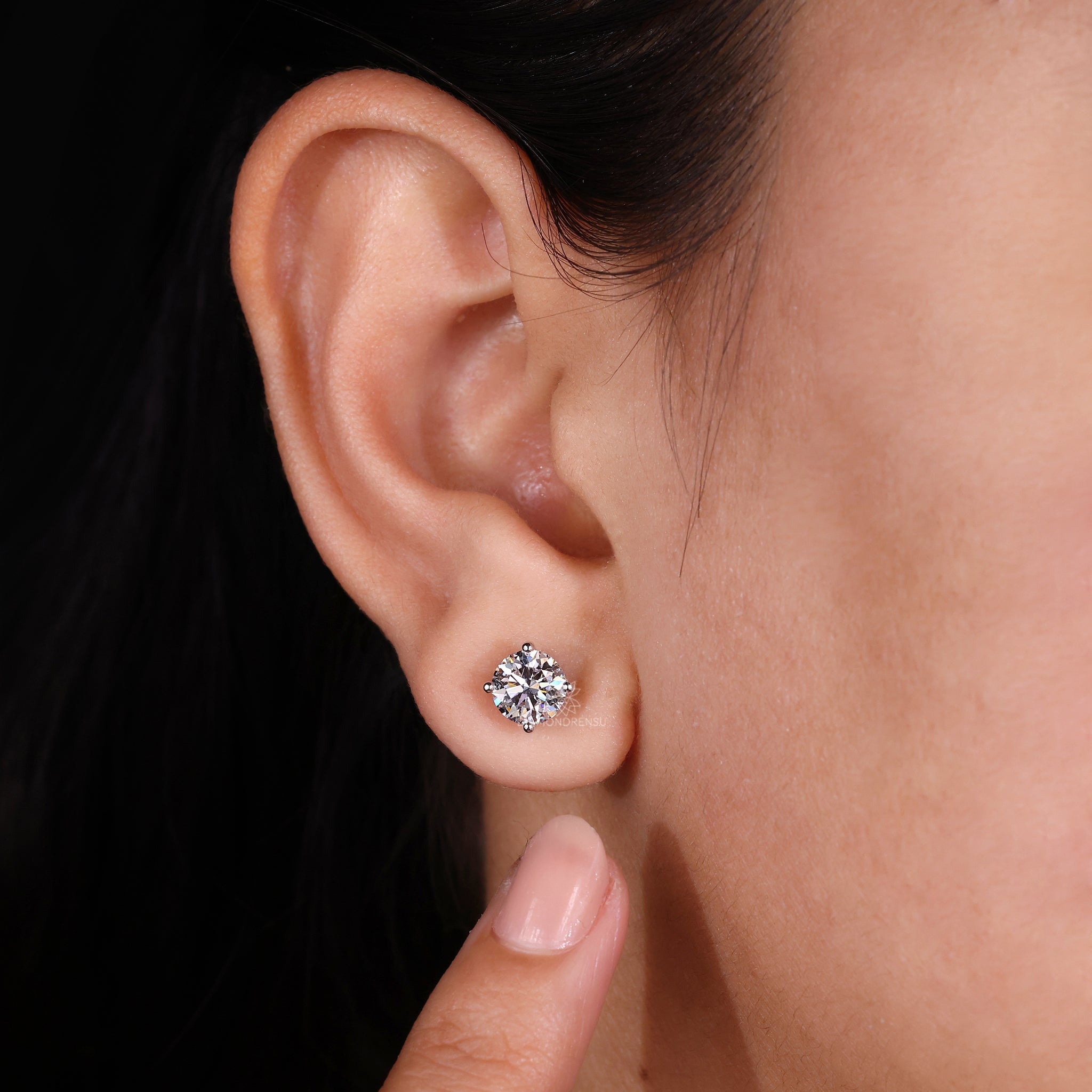 Gold stud earrings UK with classic round diamond design and 4 prong setting.