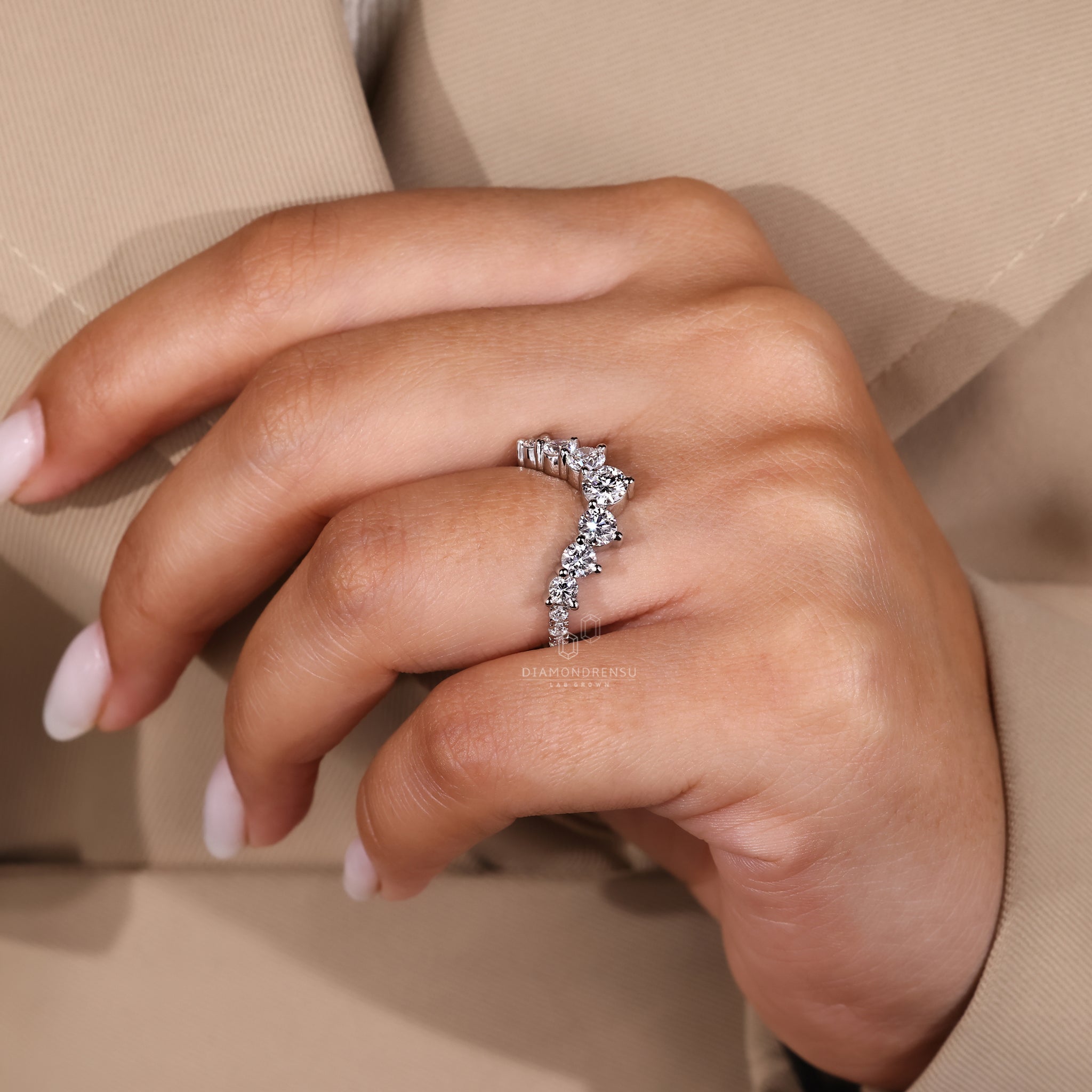 Simple wedding band crafted from white gold with handmade finish.