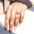 V prong ring secures the elongated hexagon cut diamond.