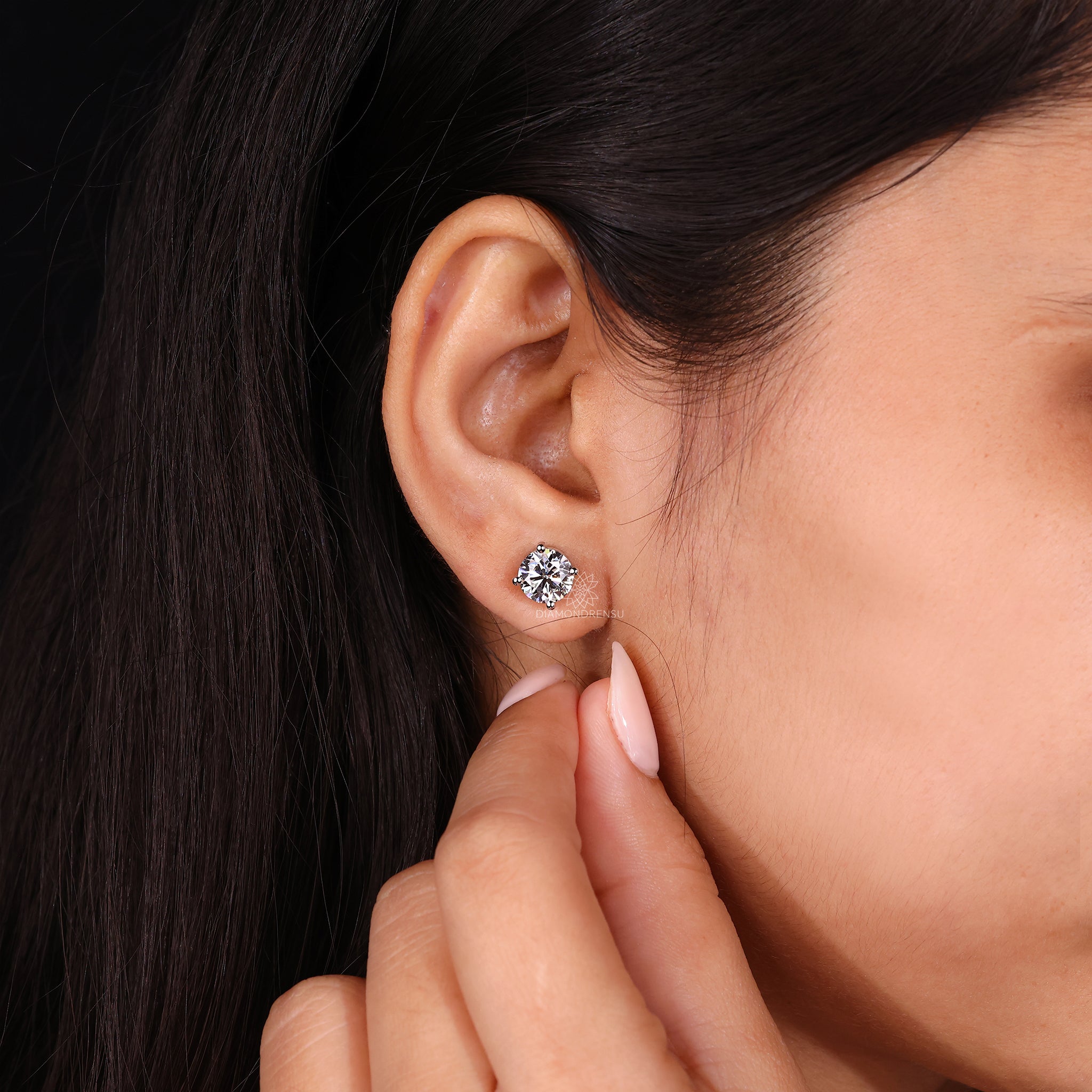 Large round diamond earrings.
