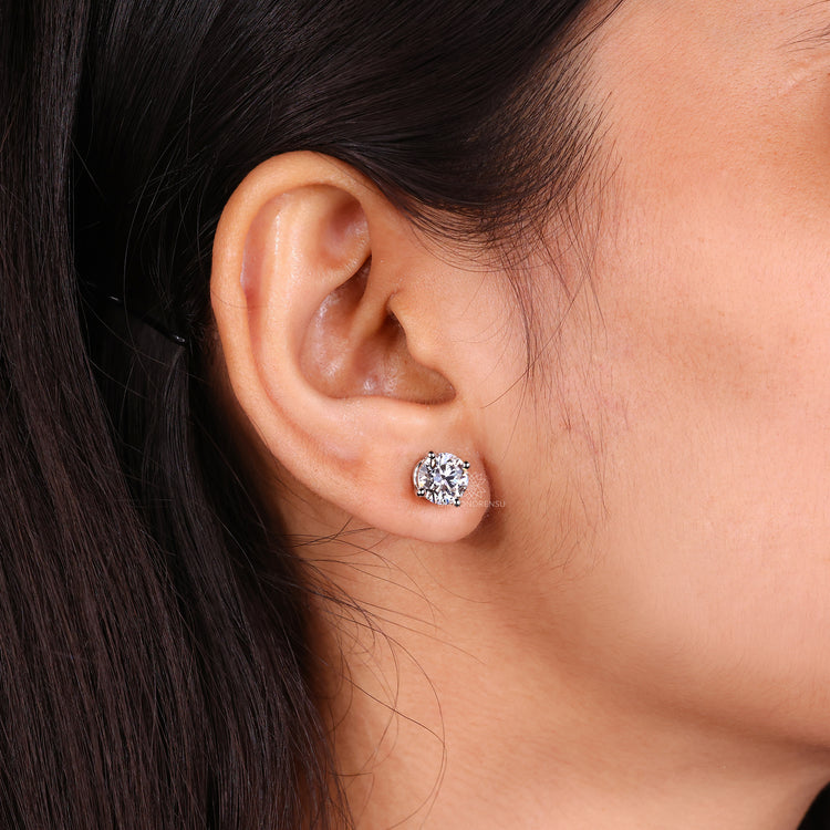 Diamond earrings with screw back closure.
