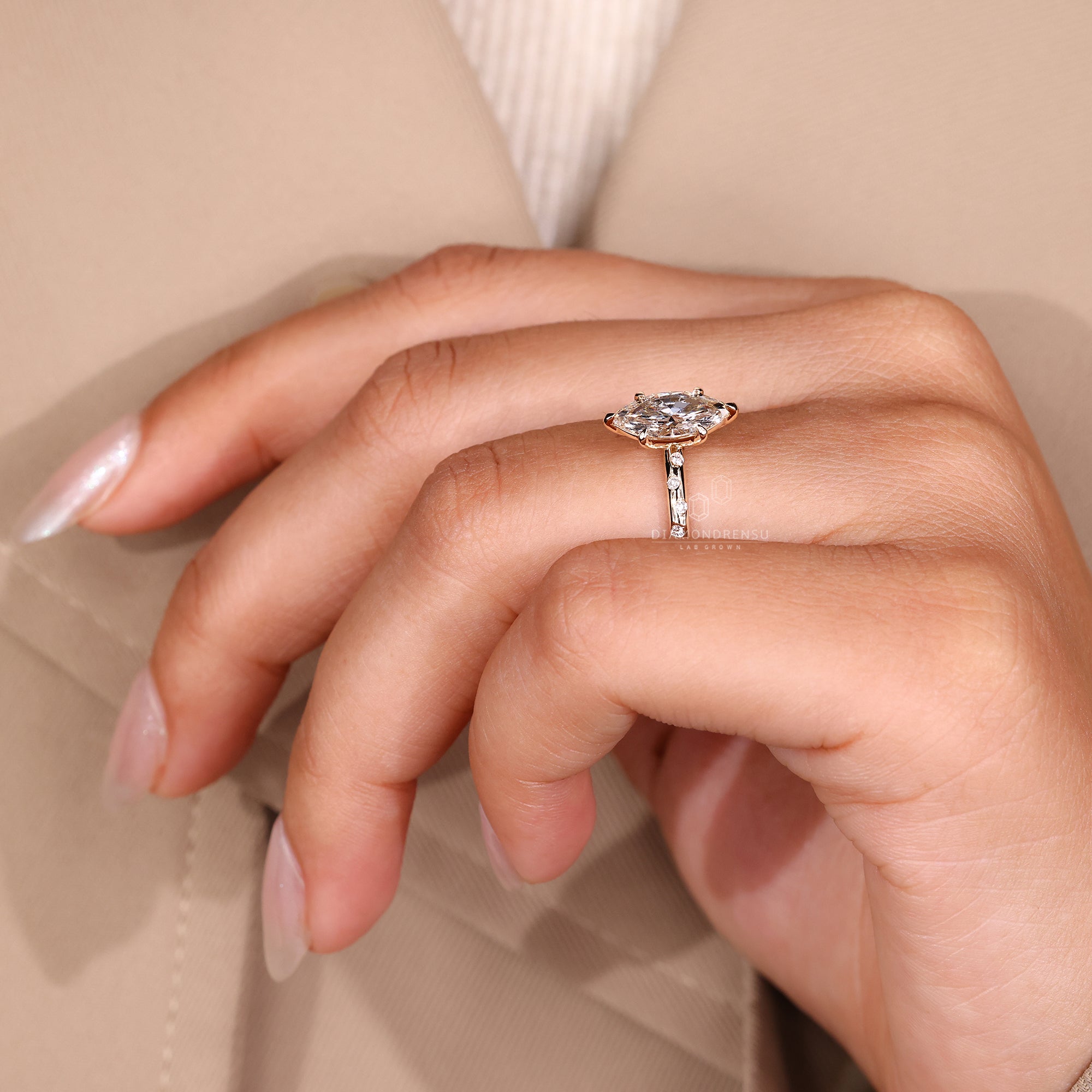 Round diamond side stone on a yellow gold band.
