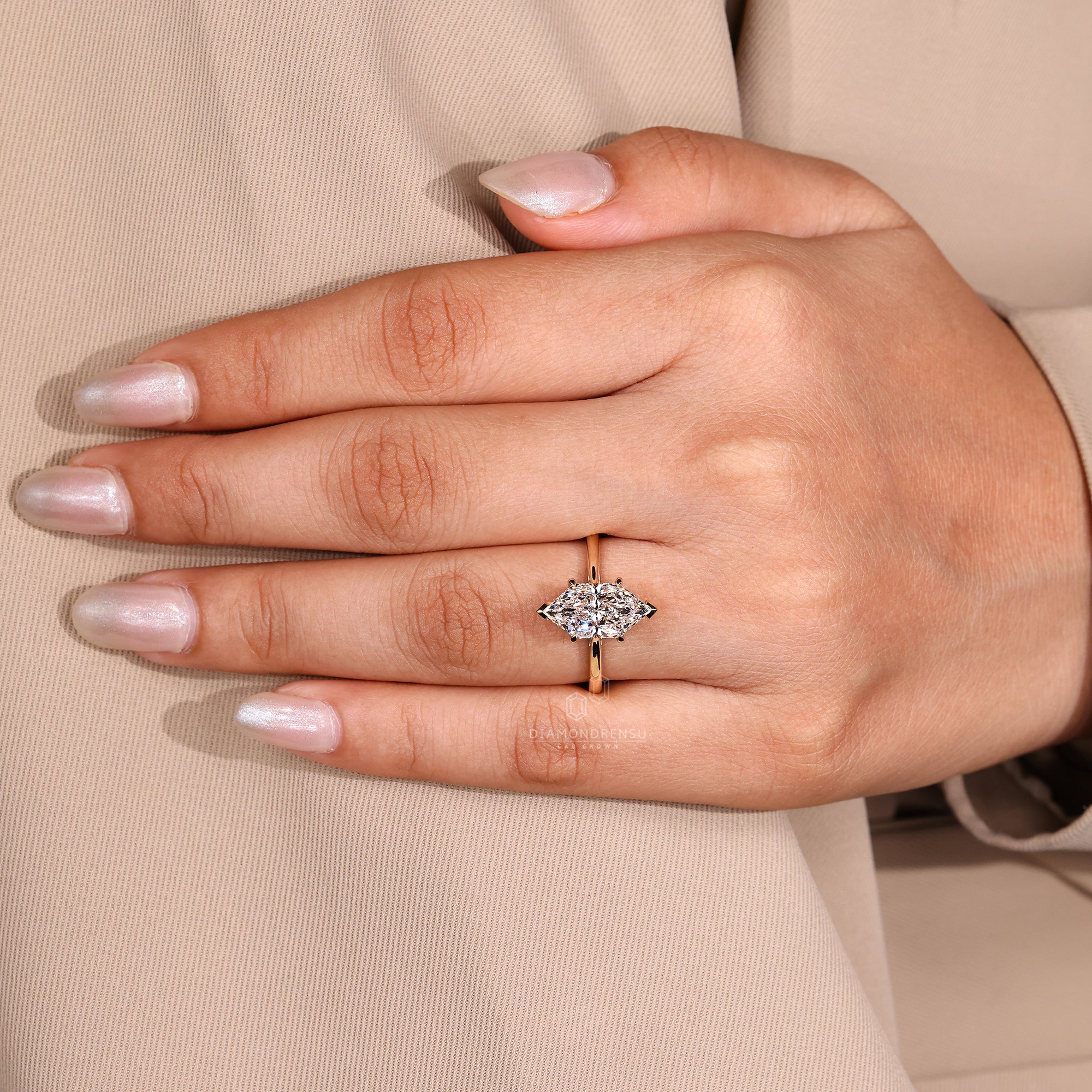 Tapered shank band with hidden halo and marquise center.
