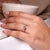 Hidden halo round diamond added under the center setting.
