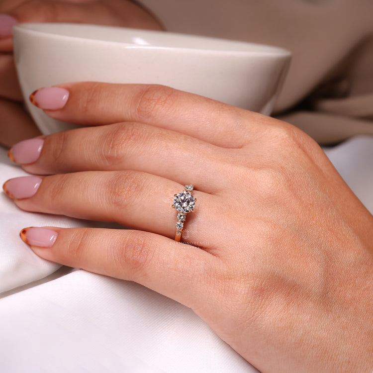 Hidden halo round diamond added under the center setting.