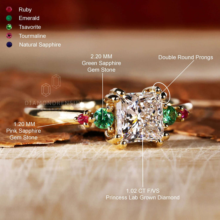 Pink sapphire engagement ring with gold princess cut band and diamond side stones for a classic yet vibrant design.