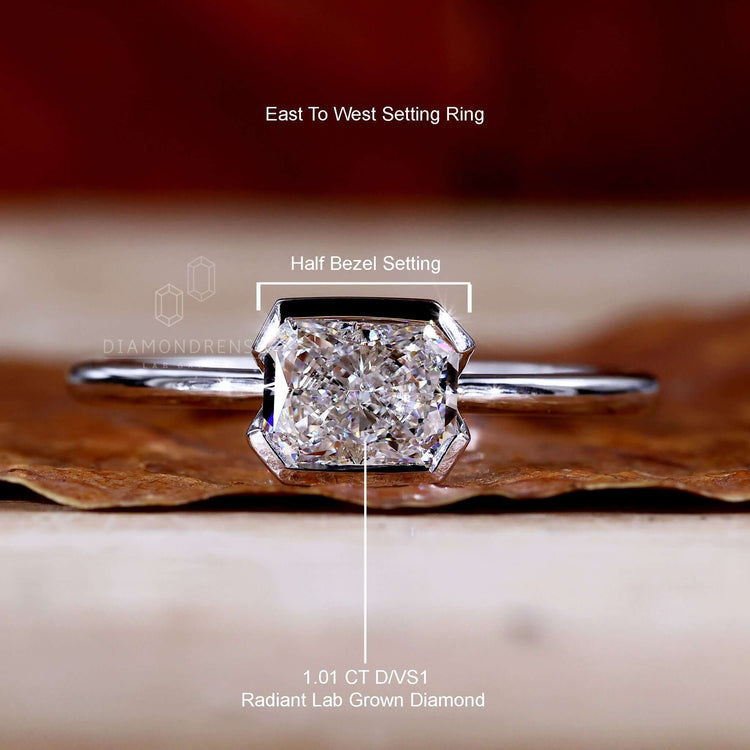 Diamond ring UK with a radiant cut diamond and East to West ring style for understated elegance.
