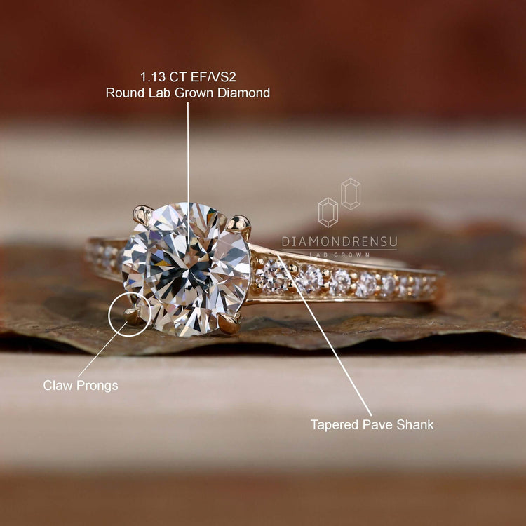 Pave diamond ring with a round diamond engagement ring and a claw prong setting, perfect for a bespoke UK engagement.
