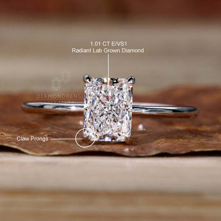 White gold radiant cut diamond ring with lab-grown diamond certification.