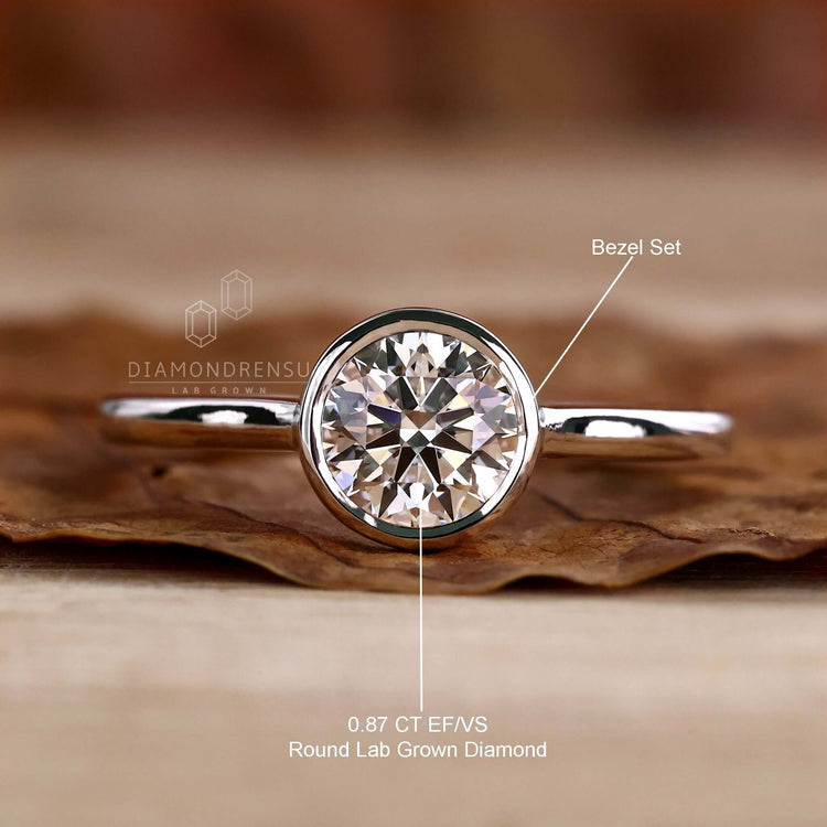 Bezel set round diamond engagement ring for women in the UK.
