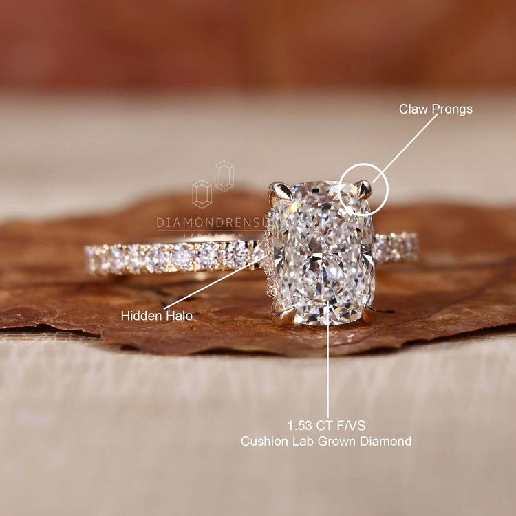 Cushion cut engagement ring with a pave setting ring and IGI-certified diamond.
