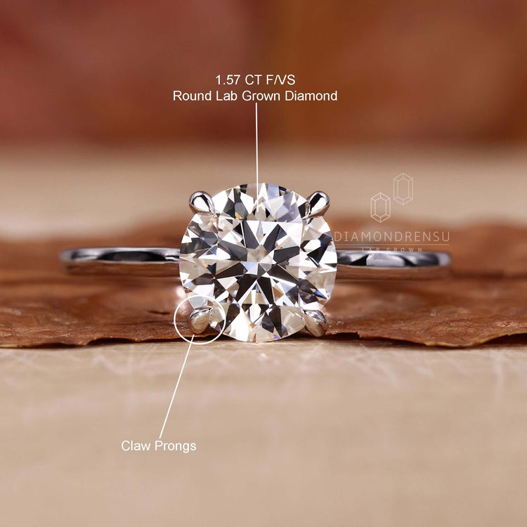 4 prong claw setting solitaire engagement ring with handmade jewellery design for a unique and custom look.