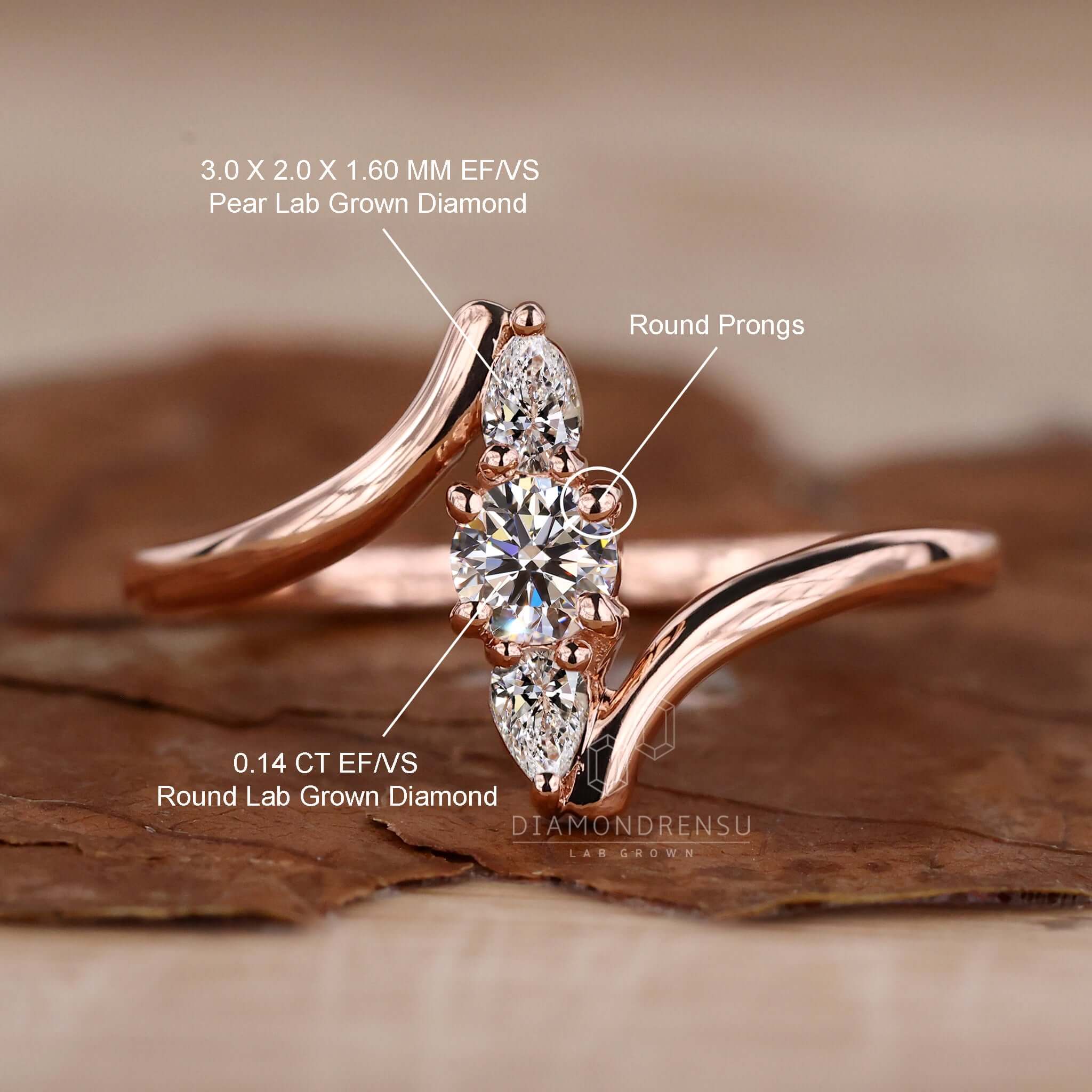 Pear shape diamond ring paired with a rose gold setting for a classic yet modern engagement piece.
