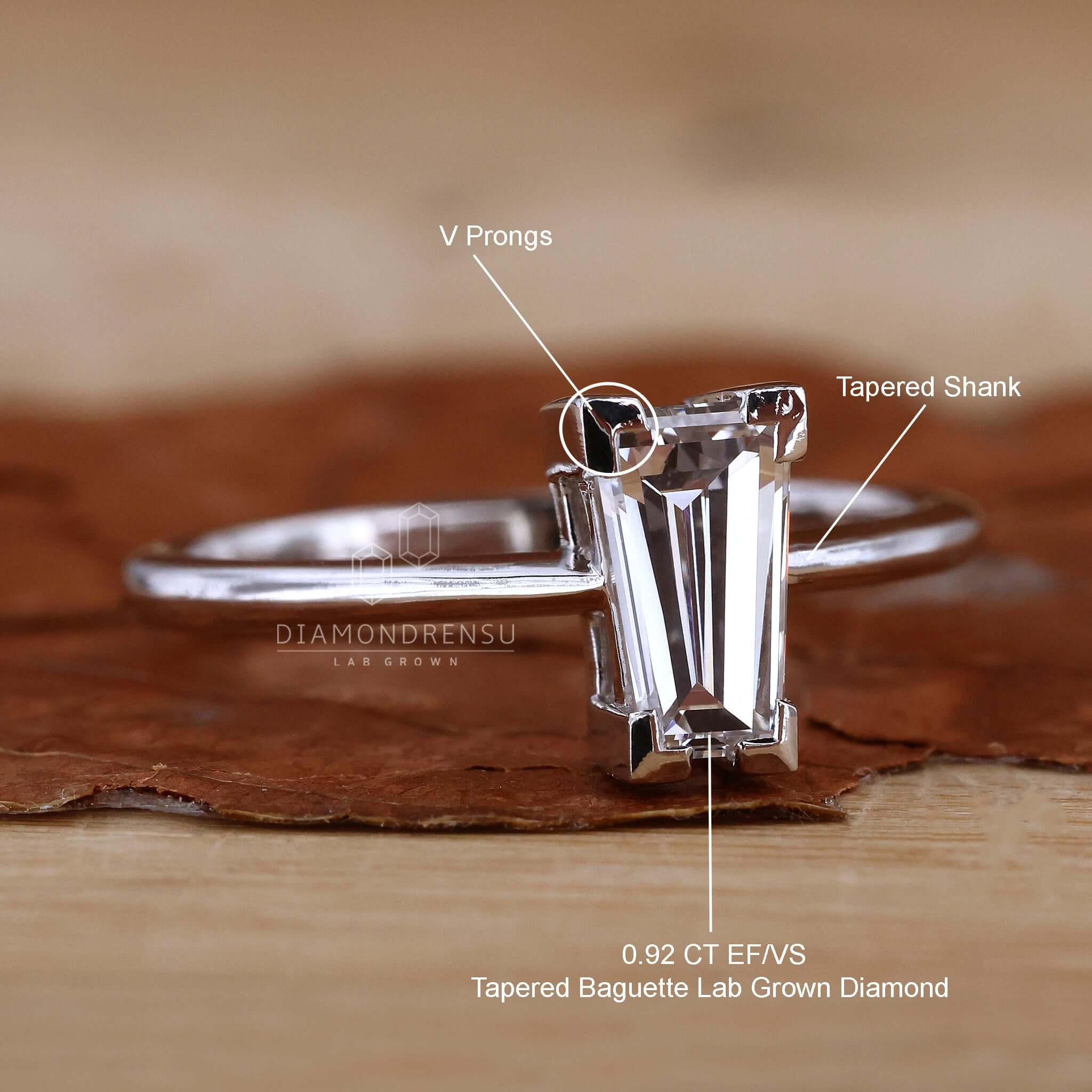 Detailed view of a tapered baguette engagement ring in a basket setting