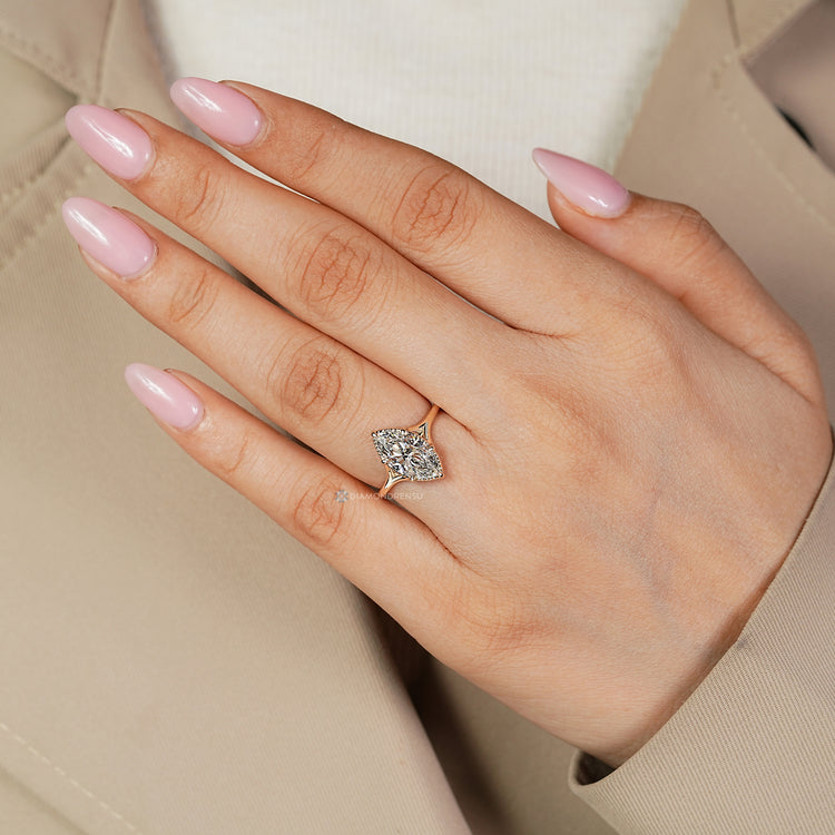 Six claw prong marquise ring with milgrain details.