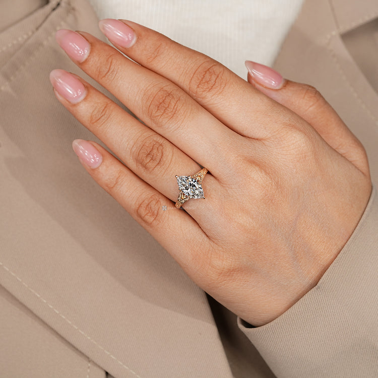 Art deco marquise engagement ring with tulip setting.