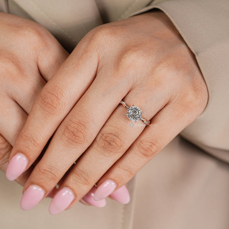 Portuguese cut diamond ring with pavé round diamonds.