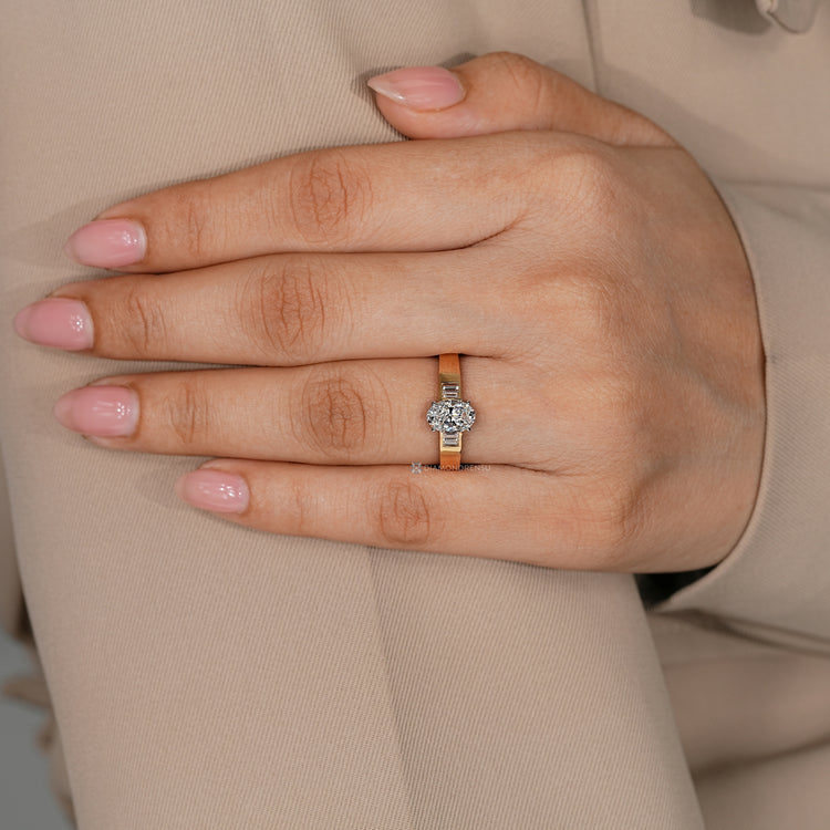 Oval cut diamond ring with baguette side stone setting.