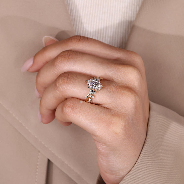 Leaf style prong setting for hexagon diamond ring.