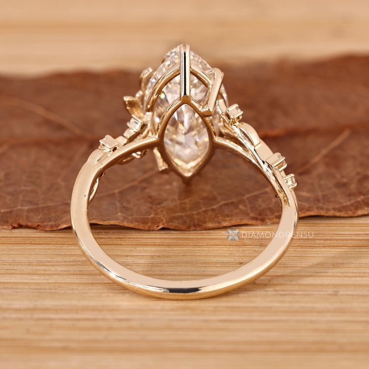 Marquise cut ring with round diamond side stones.