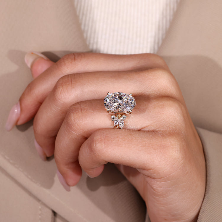 IGI certified oval lab diamond ring with side stones.
