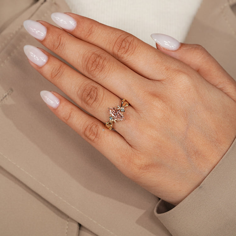 Pink centre diamond ring with twisted shank.