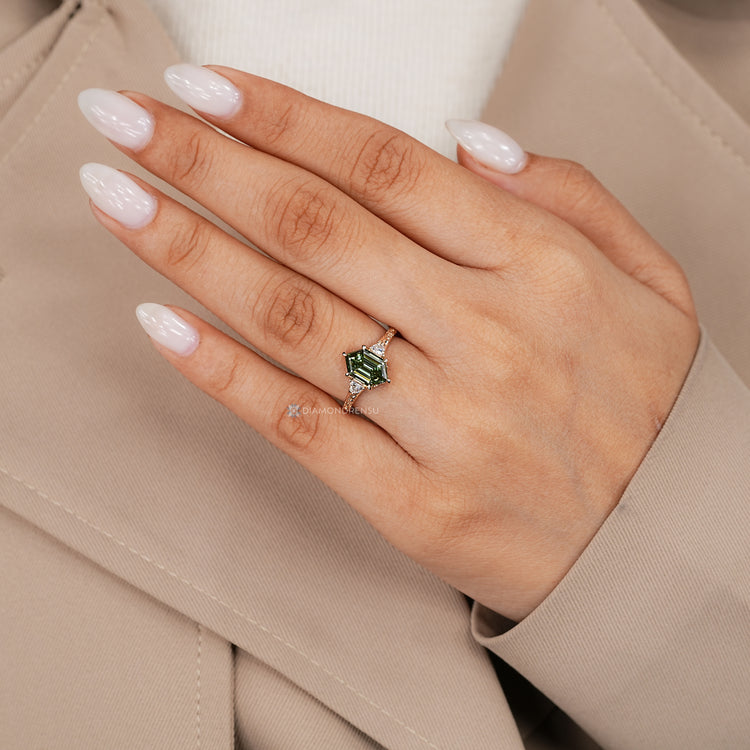 Art Deco hexagon diamond ring with six claw prongs.