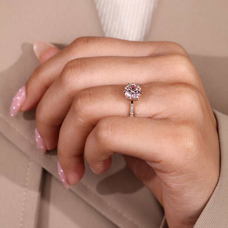 Pink centre diamond ring with tapered shank.