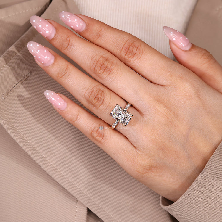 Hidden halo radiant ring with tapered shank design.